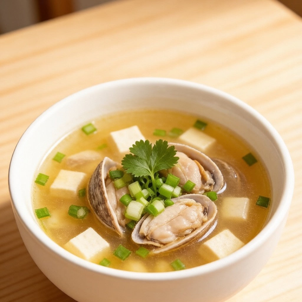 Coquina clam soup served in a white bowl